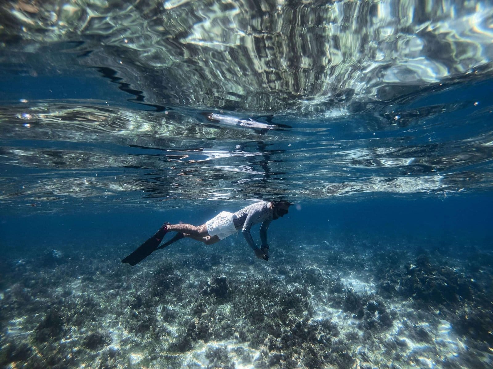 man snorkeling in white