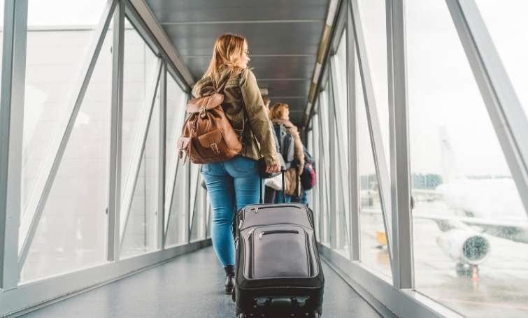 a woman ready to board in plane