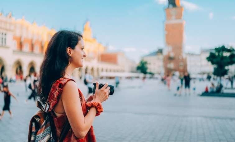 a woman with a camera taking pictures