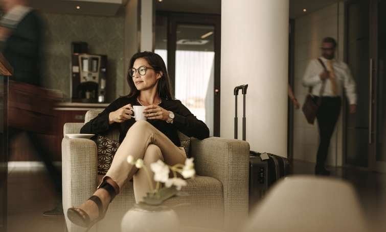 A traveler enjoys luxurious amenities in an airport lounge.