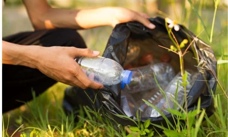 a person picking bottles