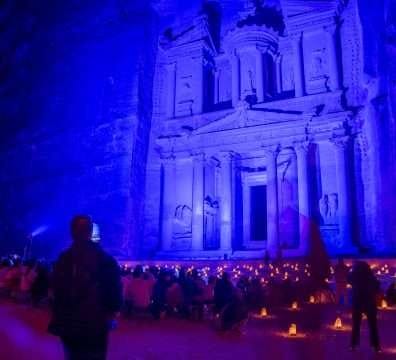 Group of diverse travelers at Petra at Night experience.