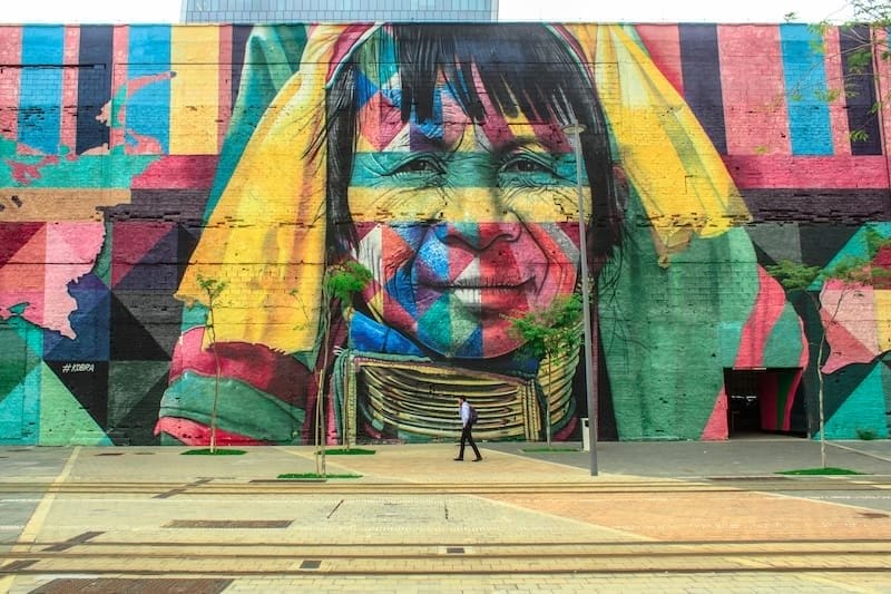 Mural with man walking by